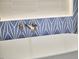 Close-up of the white bathtub and wall-mounted faucet with designer accent tiles at 2031 Englewood Ave, Durham, NC 27705