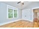 Bright bedroom with hardwood floors, large window, and closet at 2031 Englewood Ave, Durham, NC 27705
