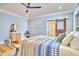 Charming bedroom with hardwood floors, soft lighting, and a rustic barn door adds character and warmth to the space at 2031 Englewood Ave, Durham, NC 27705