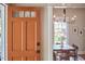 Welcoming foyer with views into the dining area with a stylish light fixture and table at 2031 Englewood Ave, Durham, NC 27705