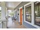 Relaxing covered porch with seating, stylish lighting, and a view of the neighborhood at 2031 Englewood Ave, Durham, NC 27705