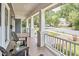 Cozy front porch with outdoor furniture, ideal for enjoying the neighborhood scenery at 2031 Englewood Ave, Durham, NC 27705