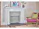 Beautiful fireplace featuring tile accents and a wood mantle, set in a cozy living space at 2031 Englewood Ave, Durham, NC 27705