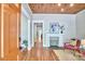 Cozy living room featuring hardwood floors, a decorative fireplace, and a wood ceiling at 2031 Englewood Ave, Durham, NC 27705
