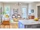 Bright living room with hardwood floors, modern lighting, and stylish furniture creates a cozy and inviting atmosphere at 2031 Englewood Ave, Durham, NC 27705