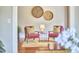 Cozy sitting area with stylish chairs, wood floors, and decorative wall hangings at 2031 Englewood Ave, Durham, NC 27705