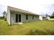 Backyard with a sliding glass door and green grass at 2039 Alderman Way, Creedmoor, NC 27522