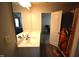 Bathroom with a sink and vanity and mirror, with a doorway to another room visible at 2039 Alderman Way, Creedmoor, NC 27522