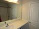 Well-lit bathroom featuring a large mirror, vanity with sink, and shower-tub combination at 2039 Alderman Way, Creedmoor, NC 27522