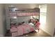 Bedroom featuring a gray bunk bed with pink bedding at 2039 Alderman Way, Creedmoor, NC 27522