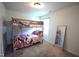 Bedroom featuring a bunk bed with a mirror, and a window with natural light and a carpeted floor at 2039 Alderman Way, Creedmoor, NC 27522