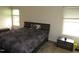 Comfortable bedroom with two windows, carpet and neutral color scheme at 2039 Alderman Way, Creedmoor, NC 27522