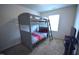 Bedroom featuring a bunk bed with carpeted floor, and a window with natural light at 2039 Alderman Way, Creedmoor, NC 27522