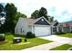 Charming home with a two-car garage, landscaped yard, and inviting curb appeal at 2039 Alderman Way, Creedmoor, NC 27522