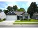 Charming single-story home with a two-car garage, manicured lawn, and inviting curb appeal at 2039 Alderman Way, Creedmoor, NC 27522