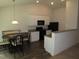 Eat-in kitchen with white cabinets, black appliances, and granite countertops at 2039 Alderman Way, Creedmoor, NC 27522
