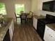 Eat-in kitchen with granite counters, gas range, and stainless sink at 2039 Alderman Way, Creedmoor, NC 27522