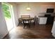 Bright breakfast nook features wood floors and a sliding glass door at 2039 Alderman Way, Creedmoor, NC 27522