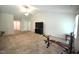 Living room with a ceiling fan, a large window, carpeted flooring, and a television at 2039 Alderman Way, Creedmoor, NC 27522
