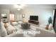 Virtually staged living room showcasing modern furniture, an open layout, and bright, neutral tones at 2039 Alderman Way, Creedmoor, NC 27522