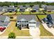 Beautiful home with well-manicured lawn, mature landscaping, and a spacious driveway at 204 Ashland Hill Dr, Holly Springs, NC 27540