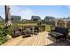 Back deck features seating area and a scenic view of the fenced-in backyard at 204 Ashland Hill Dr, Holly Springs, NC 27540