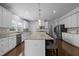Spacious kitchen with a large island, stainless steel appliances, and ample storage at 204 Ashland Hill Dr, Holly Springs, NC 27540