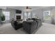 Comfortable living room with a stone fireplace, large TV, and cozy seating at 204 Ashland Hill Dr, Holly Springs, NC 27540