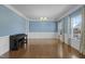 Elegant living room with hardwood floors, wainscoting, and chandelier lighting at 204 Ashland Hill Dr, Holly Springs, NC 27540