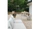 Relaxing backyard patio area with comfortable seating, a table, and decorative plants for outdoor enjoyment at 207 N Aiken St, Fuquay Varina, NC 27526