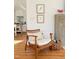 Living room area with a chair and view of the kitchen at 207 N Aiken St, Fuquay Varina, NC 27526