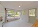 Sunroom with multiple windows, and a door to the exterior at 207 N Aiken St, Fuquay Varina, NC 27526