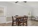 Inviting dining area featuring a table with seating for four, adjacent to the living area with ample natural light at 208 S College Ave, Kenly, NC 27542