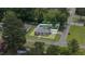 Aerial exterior view of a charming single-story home with a well-maintained lawn and fenced yard at 208 S College Ave, Kenly, NC 27542