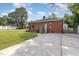 Charming single-story brick house with a welcoming front entrance and well-kept lawn at 208 S College Ave, Kenly, NC 27542