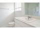 Bathroom with white sink, vanity, toilet and a tiled shower at 2316 Champion Ct, Raleigh, NC 27606
