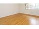 Bright bedroom with hardwood floors and natural light from the window at 2316 Champion Ct, Raleigh, NC 27606
