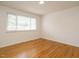 Bedroom with hardwood floors and a large window for plenty of natural light at 2316 Champion Ct, Raleigh, NC 27606
