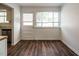 Dining area with hardwood floors, white walls, and a window at 2316 Champion Ct, Raleigh, NC 27606