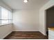 Bright dining room with wood floors and a large window for plenty of natural light at 2316 Champion Ct, Raleigh, NC 27606