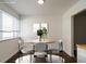 Bright dining room with wood floors and an elegant table centerpiece at 2316 Champion Ct, Raleigh, NC 27606