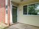 Close-up of a unit entrance door with address number and window at 2316 Champion Ct, Raleigh, NC 27606