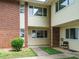 Two-story townhouse featuring brick and siding exterior with walkway to unit entrance at 2316 Champion Ct, Raleigh, NC 27606