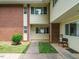 Two-story townhouse featuring brick and siding exterior with walkway to unit entrance at 2316 Champion Ct, Raleigh, NC 27606