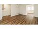 Open-concept living room with hardwood floors and staircase view at 2316 Champion Ct, Raleigh, NC 27606