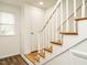 Interior view of a staircase with white banister and wood steps at 2316 Champion Ct, Raleigh, NC 27606