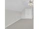 Carpeted bedroom with ceiling fan and double door closet offers ample storage at 240 Meadow Beauty Dr, Apex, NC 27539