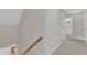 Bright hallway features neutral carpeting and connects to other rooms in the house at 240 Meadow Beauty Dr, Apex, NC 27539