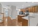 Open-concept kitchen with stainless steel appliances and a center island for seating at 240 Meadow Beauty Dr, Apex, NC 27539