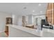 View of kitchen leading to the front door and staircase at 240 Meadow Beauty Dr, Apex, NC 27539